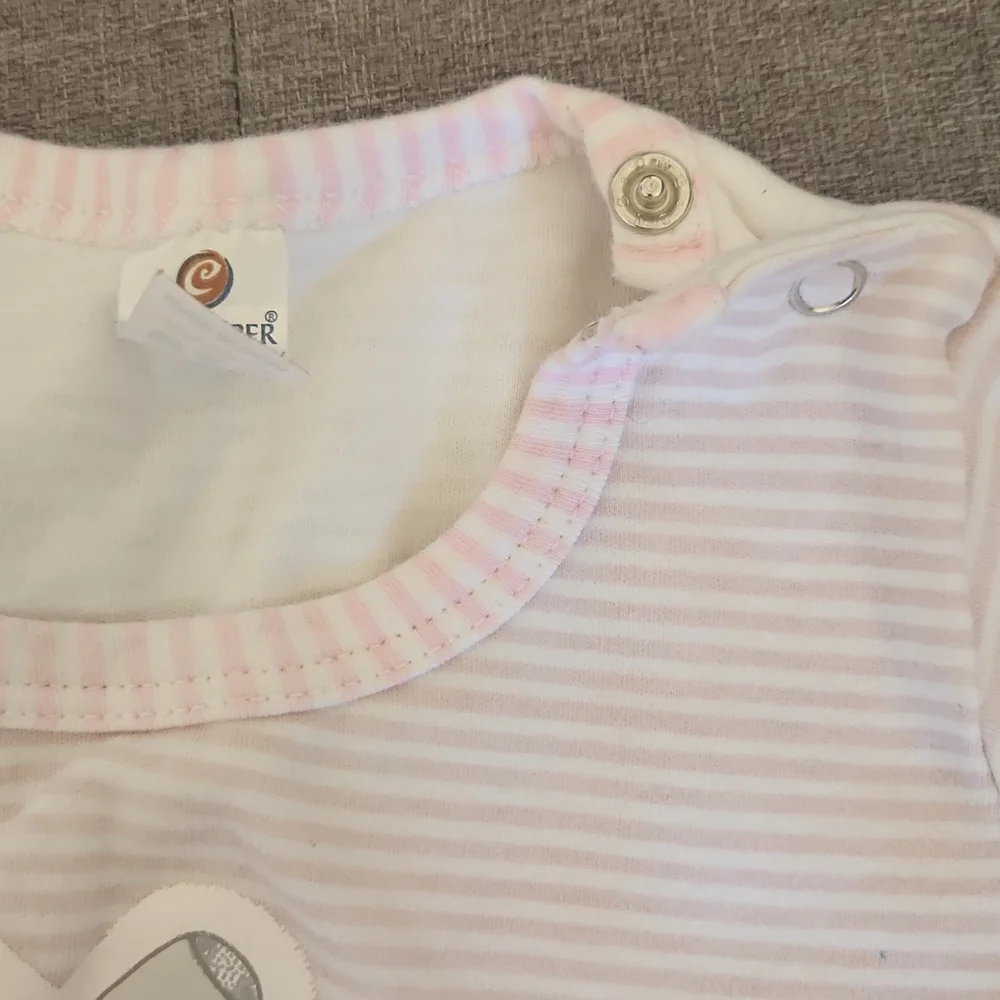 One Piece footed soft pink bodysuit